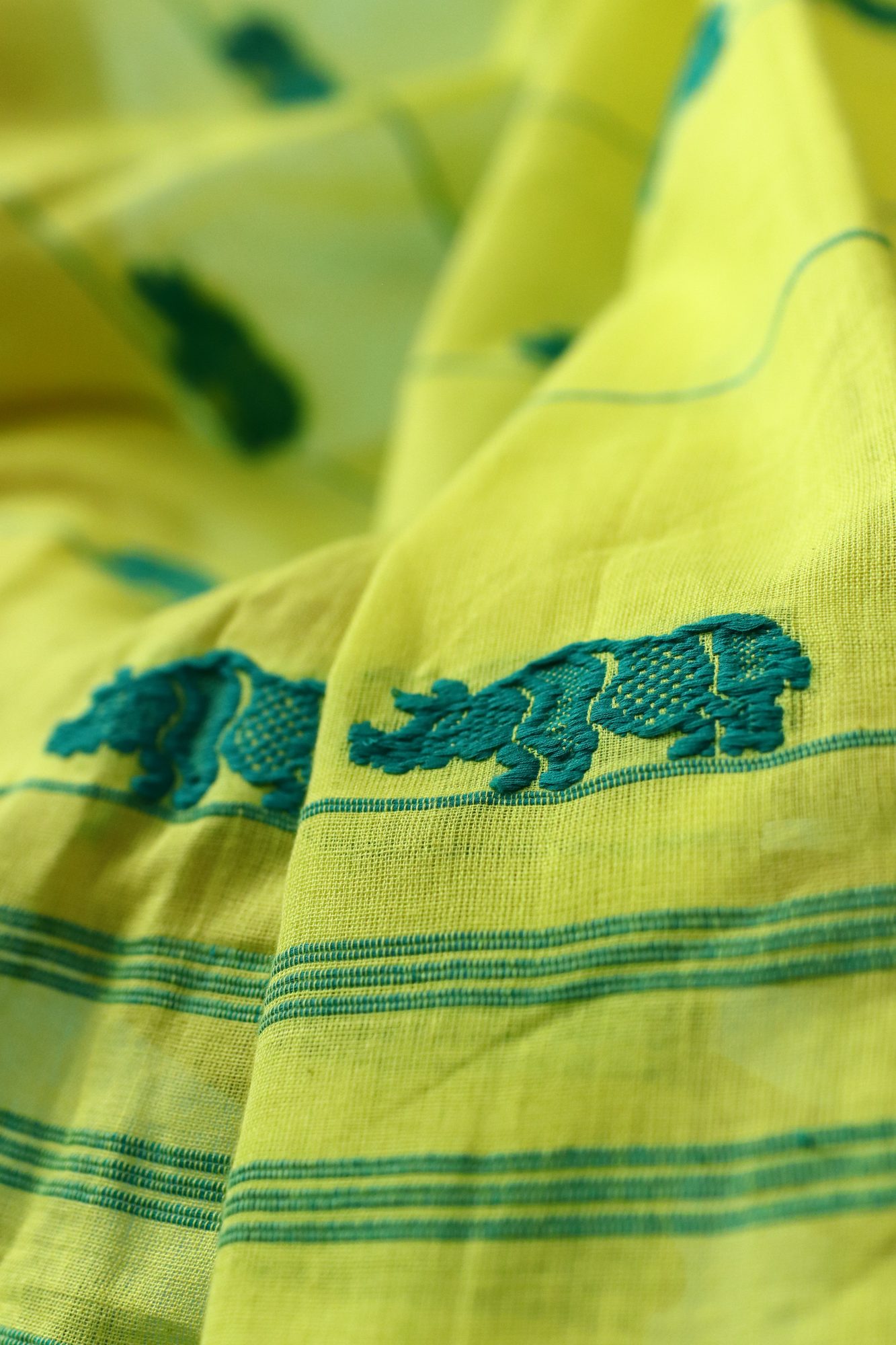 Lime Green Handwoven Saree with Rhino Motif